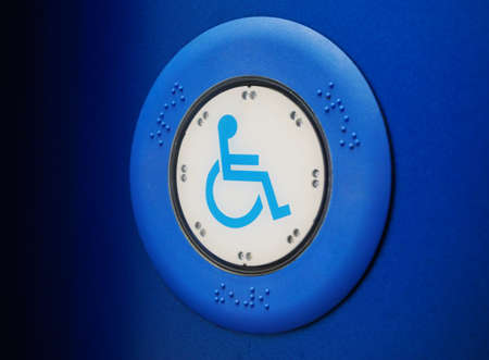 Bus button with wheelchair on side of bus, blue colored