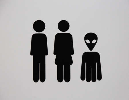 Toilet sing for man and female with alien on grey backgroundの写真素材