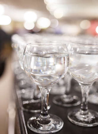 A lot of glasses of vine on a bar, soft focusの写真素材