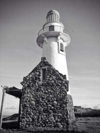 A picture of a stone house and a light houseの素材