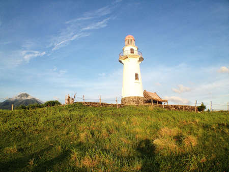 A lighthouse on top of a hillの素材