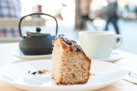 Cinnamon bread and tea on a busy walkway in Madridの写真素材