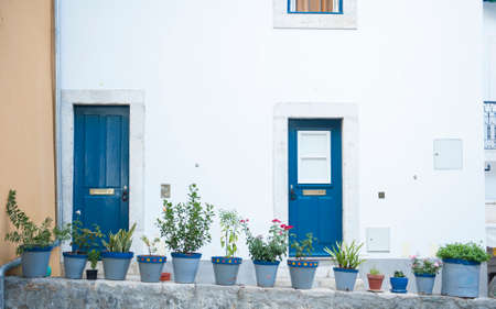 Flower vases in front of residential building in Lisbonのeditorial素材