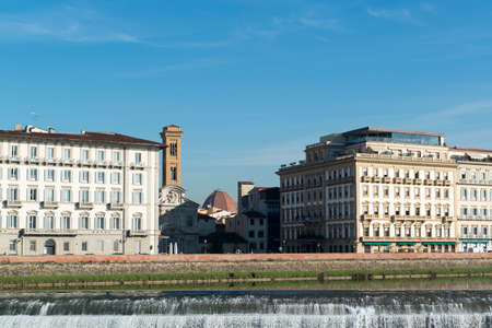 Arno river weir in Florence, Italy, on a sunny dayの写真素材