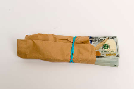 Stack of hundred dollar bills banknotes and envelopeの写真素材