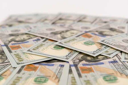 Heap of cash in hundred dollar banknotesの写真素材