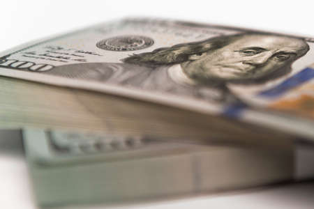 Stack of money in US dollars in cash in hundred dollar billsの写真素材