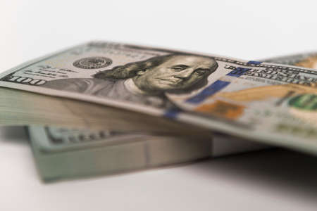 Stack of money in US dollars in cash in hundred dollar billsの写真素材