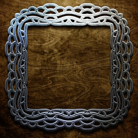 wooden plate with metal ornamental elementsの写真素材