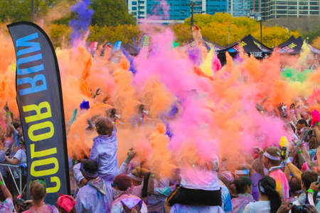 Chicago, USA - October 14, 2012: Image of the Chicago 5K Color Run to benefit Breast Cancer research. Runners are given packets of colored power to be thrown during the race.のeditorial素材