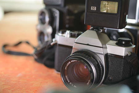 vintage photography class cameras 35 mm and 120 old camera on the table for introduction to analogue...