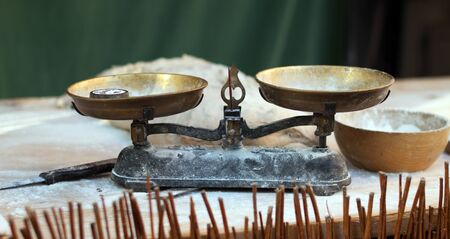 Kitchen scales and flour on the table. Baking breadの写真素材