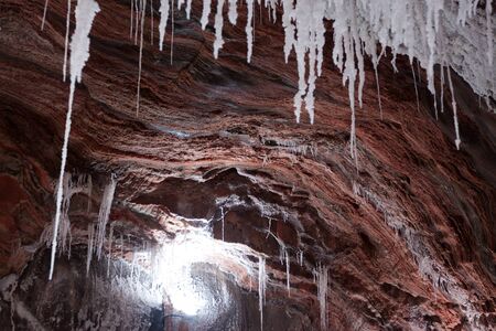 view of real salt cave with salty stalactitesの写真素材