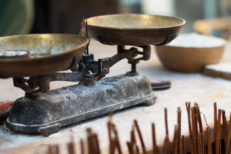 Scales and flour on the tableの写真素材