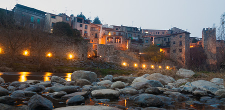 night view of old town with medieval  bridge at Besalu. Catalonia, Spainの写真素材