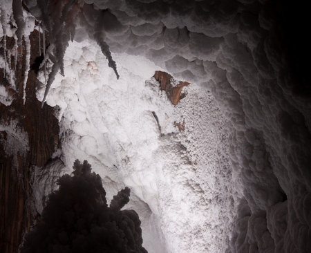 natural cave with white  salty stalactitesの写真素材