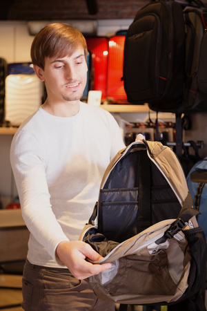 Handsome man wants to buy the satchelの写真素材