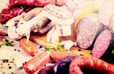 a bunch of meat and sausages of various kindsの写真素材