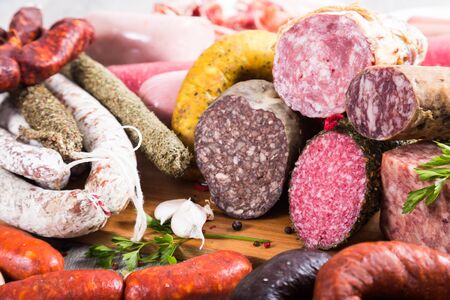 a bunch of meat and sausages of various kindsの写真素材
