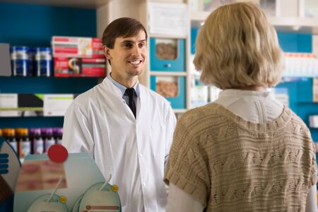 female client buys drugs at the pharmacyの写真素材