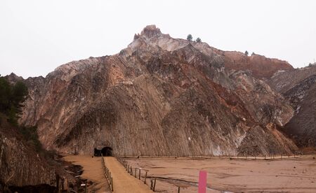 view of enter in natural grotto at cave with white  natural stalactites の写真素材