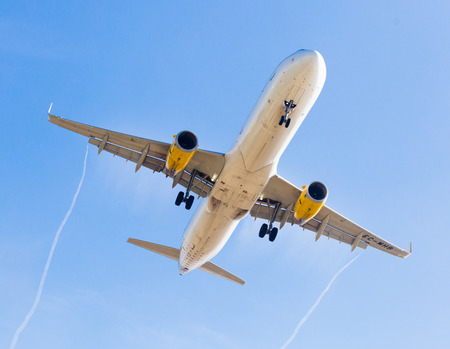 BARCELONA, SPAIN - MARCH 09, 2017:  Vueling Airlines plane landing in El Prat Airport on time. Barcelona, Spainの写真素材