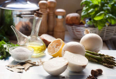 Image Salt, olive oil, onion, asparagus on a tableの写真素材