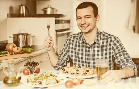 single guy going to eat pizzaの写真素材