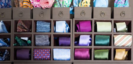 Collection of ties on hangers in men clothing storeの写真素材