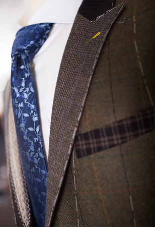 Elegant jacket with shirt and tie on mannequinの写真素材