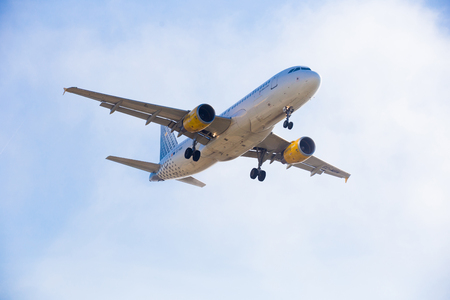 BARCELONA, SPAIN - MARCH 09, 2017:  Vueling Airlines plane landing in El Prat Airport on time. Barcelona, Spainのeditorial素材