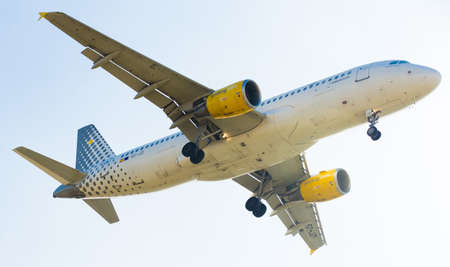 BARCELONA, SPAIN - MARCH 09, 2017:  Vueling Airlines plane arriving at El Prat Airport on schedule. Barcelona, Cataloniaのeditorial素材