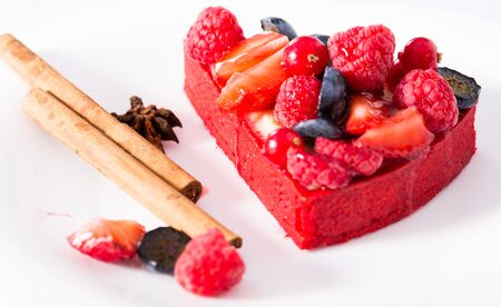 Delicious cake with fresh forest berries with cinnamon and aniseの写真素材