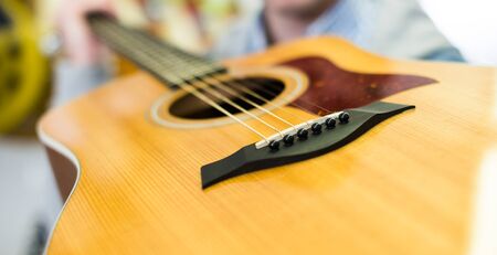 Close up of lower bout of guitarの写真素材