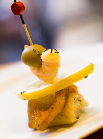 Sophistication pintxos with shrimps lemon and oliveの写真素材