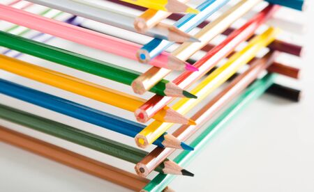 colored pencils stacked in log houseの写真素材