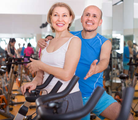 smiling mature couple posing in the gymの写真素材