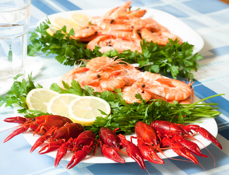 cooked shrimp and crayfish served on plate close upの写真素材