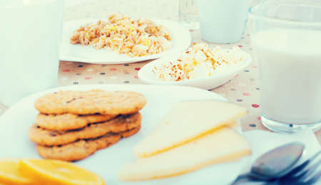 healthy breakfast of oatmeal, biscuits and milk for healthy wholesome breakfastの写真素材