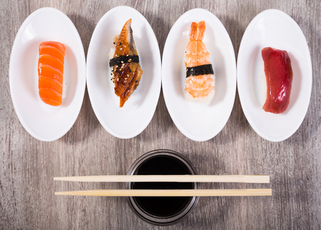 four kinds of Nigirisushi on oval platesの写真素材