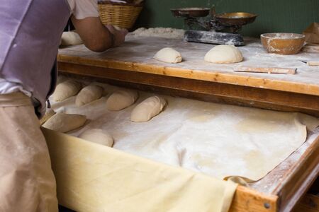 process of making bread in a traditional bakeryの写真素材