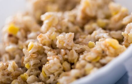 close up of plate with cereal porridge for breakfastの写真素材
