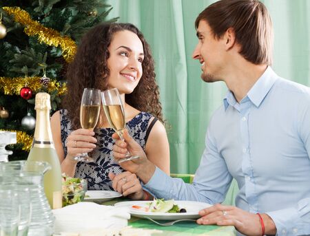 Young  lovers celebrating the New Year together at homeの写真素材
