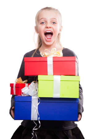 portrait of blonde girl holding in hands lots of boxes with gifts on isolated backgroundの写真素材