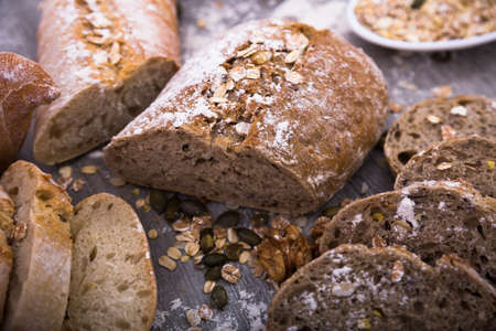 bread in a cut on a wooden tableの写真素材