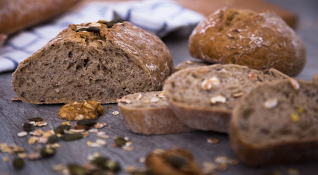 crispy loaf of bread on a wooden boardの写真素材