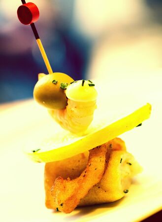 Sophistication pintxos with shrimps lemon and oliveの写真素材