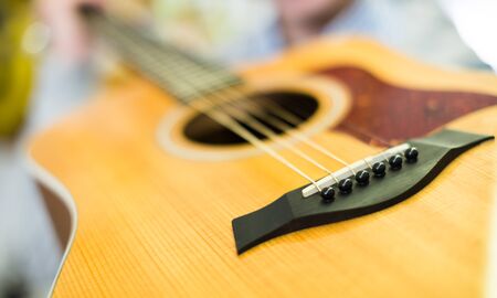 Close-up of saddle of Six-string guitarの写真素材