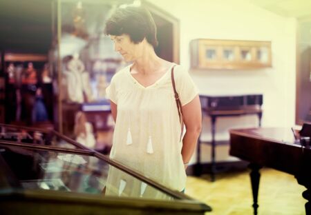 female pensioner visiting historical exhibition in National Museumの写真素材