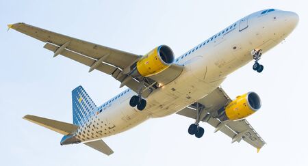 BARCELONA, SPAIN - MARCH 09, 2017:  Vueling Airlines plane landing in El Prat Airport on time. Barcelona, Spainのeditorial素材